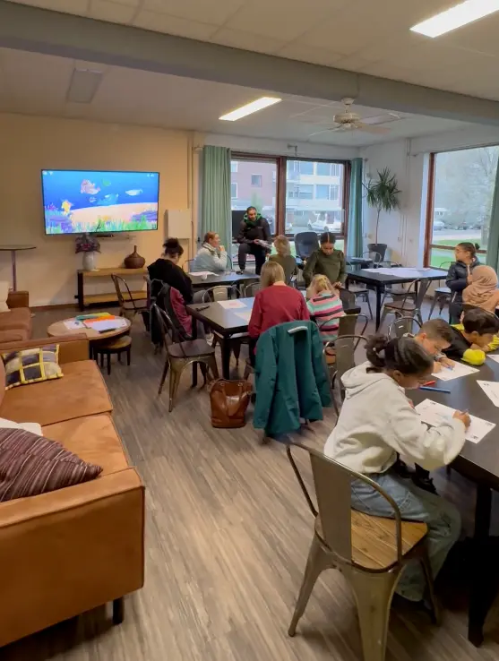 People in a social home having a Dibulo coloring session